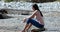 Woman On Beach Drawing On Sand