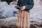 Woman on beach with driftwood