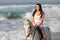 Woman beach horse ride
