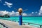 Woman on a beach jetty at Maldives