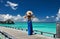 Woman on a beach jetty at Maldives