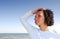 Woman on the beach looking away