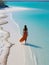 woman beach sand paradise ocean sea back drone top view waves silence serenity zen tranquility