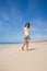 Woman in beach sticking out tongue