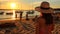 woman on beach at sunset sea,people relax ,yacht boat on sea water,