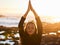 Woman, beach yoga and sunset with pray hands, eyes closed and peace of mind in summer sunshine. Girl, zen meditation and