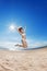 Woman on the beach. Young girl on the sand by sea.