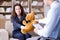 The woman with bear toy during psychologist visit