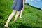 Woman bearfoot walk in grass