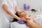 Woman beautician doctor make neck massage in spa wellness center