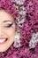 Woman beautiful face with flower lilac