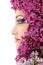 Woman beautiful face with flower lilac