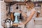 Woman with beautiful hair mixing in a container in a kitchen corner