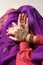 Woman with beautiful henna tattoos on hands, closeup. Traditional mehndi