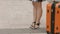 Woman with beautiful legs in high heel shoes waiting for train, bus at station