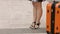 Woman with beautiful legs in high heel shoes waiting for train, bus station