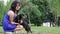 Woman beautiful young happy with long dark hair in blue dress holding small dachshund dog