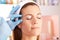 Woman in beauty clinic getting botox injection