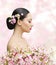 Woman Beauty Portrait in Sakura Flower, Asian Girl Bun Hairstyle