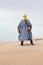 Woman in bedouin clothes in desert