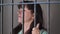 Woman behind bars in prison wants to be released, bad emotions