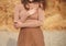 Woman in beige posing on the beach. hands closeup