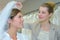 Woman being fitted with wedding veil