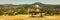 Woman on a bench looking at Auvergne landscape panorama