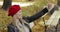 Woman in beret taking selfie in park