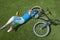 Woman With Bicycle Lying On Grass In Park