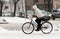 Woman on the bicycle in winter