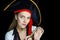 Woman with big black pirate hat