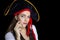 Woman with big black pirate hat