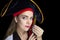 Woman with big black pirate hat