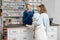 Woman with big white dog in veterinary clinic