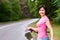 Woman with bike on the rainy forest