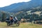 Woman biker with big adventure motorbike, motorcyclists vacation, world traveler, long road trip on two wheels. autumn day.