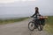 Woman biker on a road