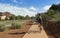 A Woman Bikes Toward Bell Rock in Sedona