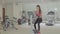 Woman biking in the gym, exercising legs doing cardio training cycling bikes