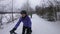 Woman biking in winter on fat bike. Fat biker riding bicycle in the snow in winter. Selfie video by woman living healthy