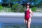 Woman and bikini crimson shape larg on beach