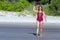 Woman and bikini crimson show hat on beach Ban Krut