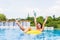 woman in bikini enjoying summer sun and tanning during holidays in pool with cocktail. Top view. Woman in swimming pool.