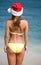 Woman in bikini and hat of Santa Claus