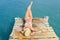 Woman in bikini lying on the dock