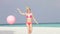 Woman In Bikini Running On Beautiful Beach With Balloon