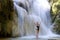 Woman and bikini show shape at Erawan Waterfall
