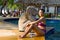 Woman with bikini sit relax on pool