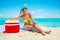 Woman in bikini sunbathing on the beach in Exuma, Bahamas